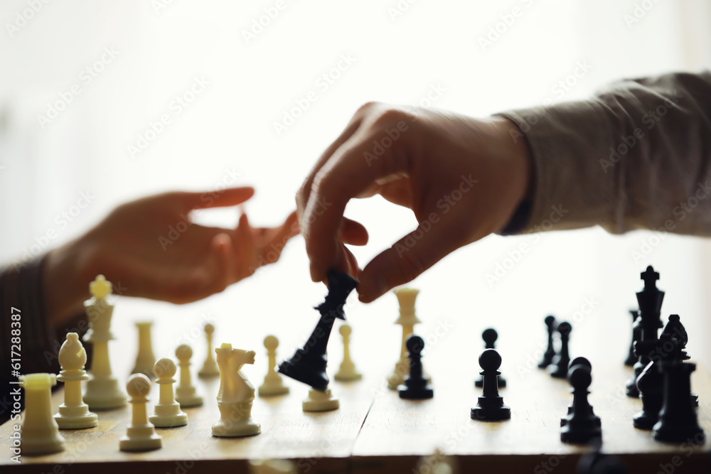 Wall mural hand playing game of chess, competition, strategy, battle, play