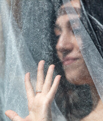 Young beautiful bride in a white wedding dress and veil on her wedding day