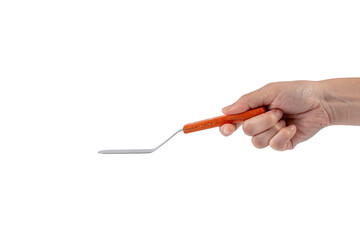 Pastry spatula in hand on transparent background isolation