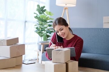 Portrait smile beautiful business asian designer woman with pink suit working office desk using phone computer. Small business employee freelance online sme marketing e-commerce telemarketing concept