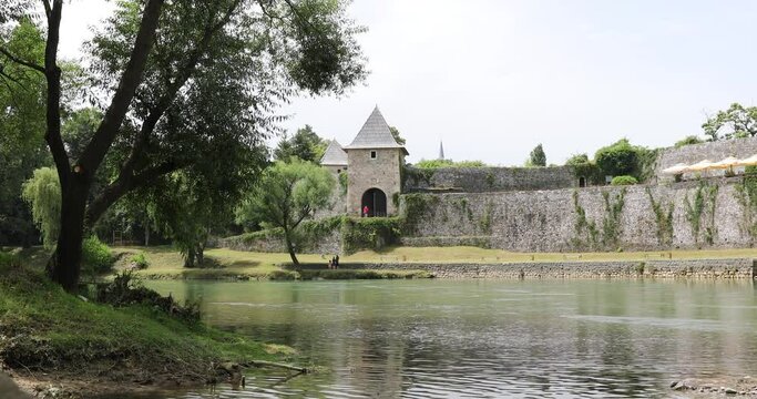 Banja Luka, Bosnia and Herzegovina - June 23 2023: 
Park along the river Vrbas beneath the walls of Kastel Fortress in Banja Luka, Bosnia and Herzegovina - Image