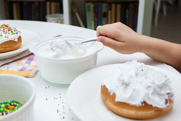 Process of decorating a cake with sweet colored decorations, concept of cooking of an Easter cake