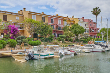 Fototapeta na wymiar Panoramic view of colorfull houses and moored yachts in Port Saplaya