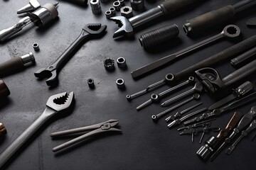 Fototapeta na wymiar Auto mechanic's tools on grey stone table with copy space