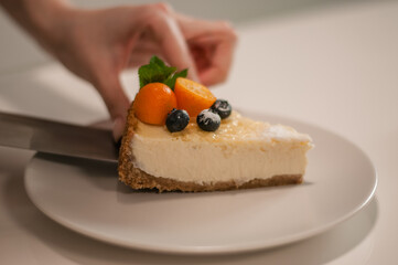 Cheesecake with citrus and berries is prepared in the kitchen