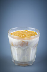 Dirty Coffee style in a clear coffee cup isolated on grey background