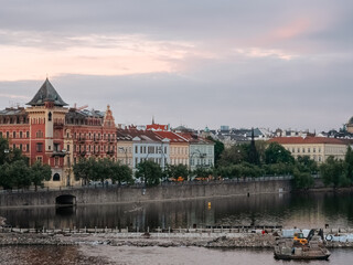 Old houses on the Vltava embankment in Prague. Beautiful old city. Multicolored facades of houses in a European city