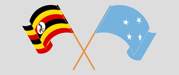 Crossed and waving flags of Uganda and Micronesia