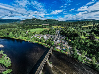 Dunkeld, Perthshire, Scotland by drone. Includes the bridge from Birnam to Dunkeld. Sunny day in summer.