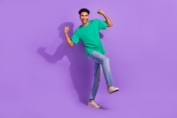 Fototapeta na wymiar Full size photo of glad cheerful person raise fists accomplishment luck isolated on violet color background