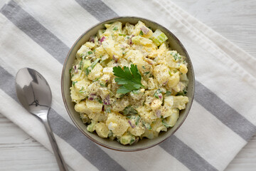 Homemade Potato Egg Salad with Pickles in a Bowl, top view. Flat lay, overhead, from above.