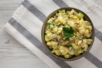 Homemade Potato Egg Salad with Pickles in a Bowl, top view. Flat lay, overhead, from above. Copy space.