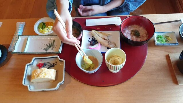 Morning breakfast Japanese food set at ryokan porridge grill fish egg eating healthy food