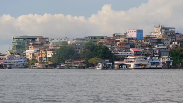Favelas Humble Houses, River Coast of Manaus Brazil from The Boat Panoramic View