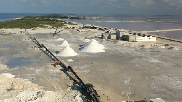 Coastal saltern with mounds of dried salt and saltworks in Yucatan.