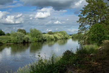 Fototapeta na wymiar river with reflection of sky in water