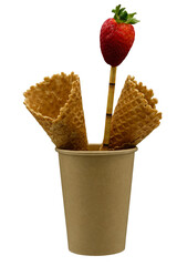 Disposable paper cup with a drinking straw. Edible wafer cups or cones. Strawberries.