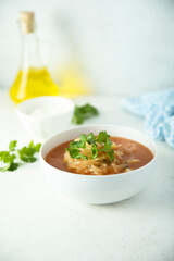 Traditional homemade sauerkraut soup with fresh parsley