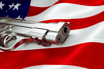 Image of a gun with the American Flag in the background. Silver pistol. Firearm