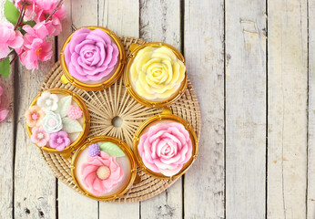 Top view of Thai colorful dessert - coconut milk jelly in variant flower shape , beautiful and delicious . Homemade cuisine