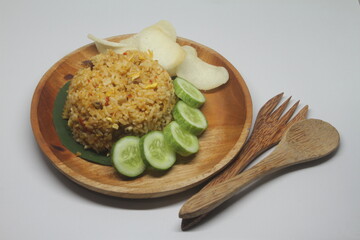 Chinese Asian Egg and Vegetable Fried Rice on Wooden Plate on White Background.
