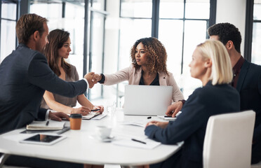 Business people, handshake and meeting in team strategy, partnership or collaboration at office conference. Woman shaking hands with employee in teamwork planning, agreement or deal at the workplace