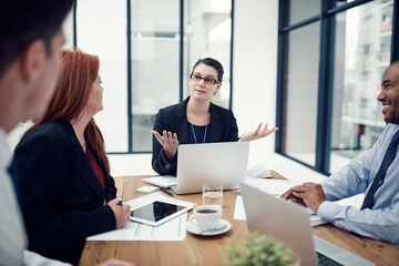 Meeting, questions and business people with a laptop for planning, collaboration and strategy discussion in office. Teamwork, proposal and designer team with diversity or strategy for design proposal