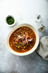 Homemade lentil soup with smoked bacon
