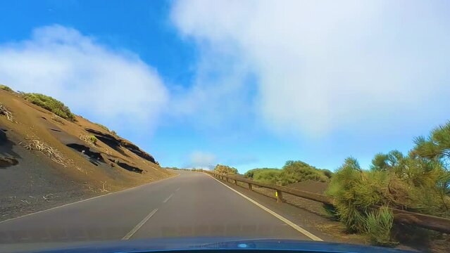 Scenic Drive In Teide National Park's Curvy Roads, Surrounded By A Desert Landscape With A Clear Blue Sky, Driver POV, Tenerife, Canary Islands, Spain
