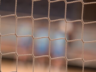 Tournament view through the protective net of  futsal match. - 617336149