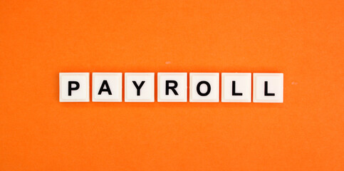 letters of the alphabet with the word payroll. payroll concept. business concept