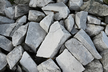 a bunch of beautiful white stones with a noticeable texture and cracks