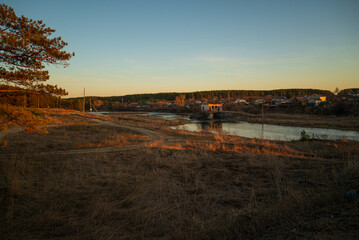 Obraz premium sunset over the river