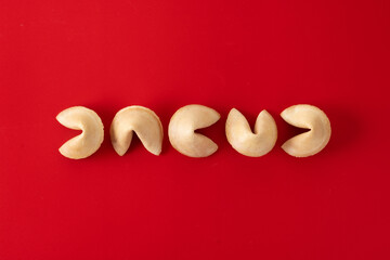 Traditional fortune cookies on red background
