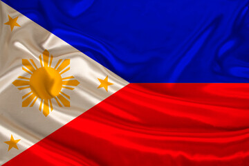 silk national flag of the modern state of the philippines with beautiful folds flutters in the...