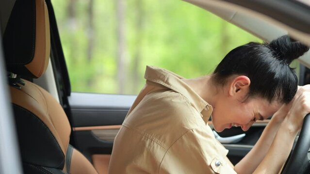Brunette woman mad at offending driver clipping modern car on busy roadway. Businesswoman yells at unknown person and tries to signal on road