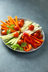 Raw vegetable platter with fresh basil