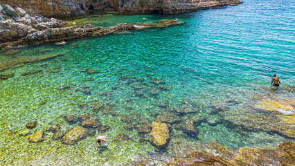 Aerial view of  Famous Cyclone beach near Pula. Rocks in clear water. Istria. Croatia