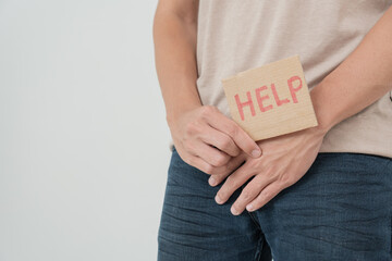 Man hold hand in front of private parts feeling discomfort from disease and inflammation. Venereal,...