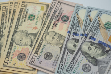 USD currency , Many dollar bank notes Placed on the table.The  Dollar is the currency of USA that is used to change, buy, sell, accumulate, and invest in united kingdom's state people.