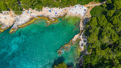 Aerial view of  Famous Cyclone beach near Pula. Rocks in clear water. Istria. Croatia