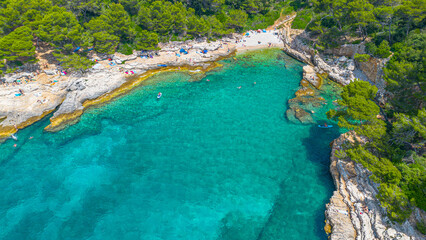 Aerial view of  Famous Cyclone beach near Pula. Rocks in clear water. Istria. Croatia