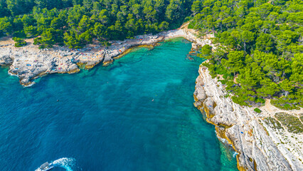 Fototapeta na wymiar Aerial view of Famous Cyclone beach near Pula. Rocks in clear water. Istria. Croatia