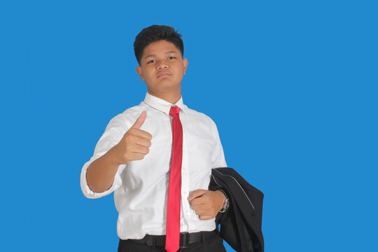 man gesturing a thumb up sign in front of camera isolated on white background
