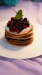 Delicious pancakes with fresh berries