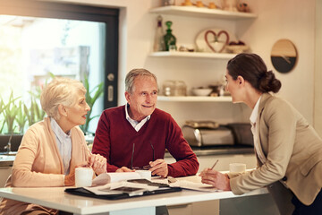 Senior couple, financial advisor and documents for bills, budget or retirement plan in expenses at home. Elderly man and woman in finance discussion with consultant or lawyer for paperwork or loan