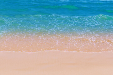 Light blue sea waves on clean sandy beach, Tropical white sand beach and soft sunshine background