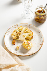 Close up of baked cauliflower vegan steak on plate food
