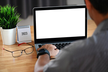 Empower Your Business with a Blank Screen Laptop on a Businessman's Desk