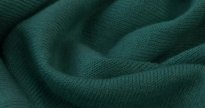 Teal fabric background.